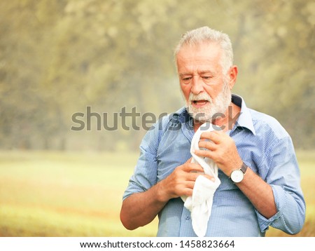 The old people were panting in the hot weather. Royalty-Free Stock Photo #1458823664