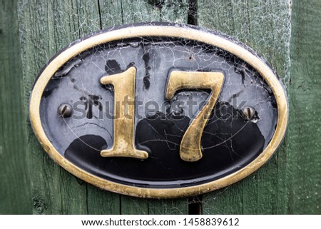 Written Wording in Distressed State Typography Found Number 17 Seventeen Royalty-Free Stock Photo #1458839612