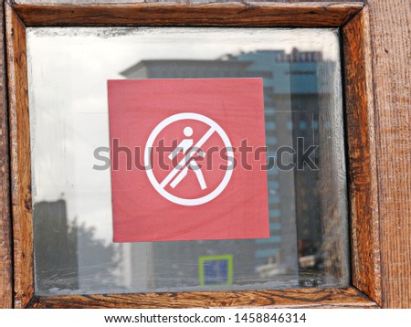 
Sign - pass is prohibited. Red sticker attached to glass.					