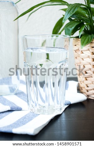 A glass of water with a blurred background. Top view. Fresh image.