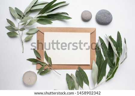 Flat lay wedding invitation, close-up cards with ribbons, stones and leaves. card mockup