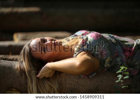 Portrait of a girl sitting on logs