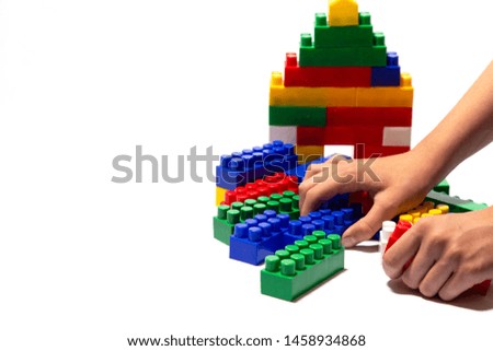 Multi-colored children's cubes the designer on a white background with which the child plays.
