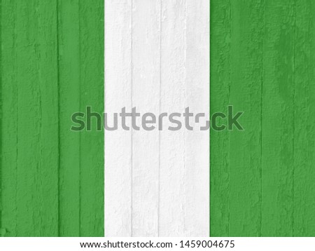 The national flag of the Federal Republic of Nigeria, painted on old scratched boards. Watercolor effect. Can be used as a background.