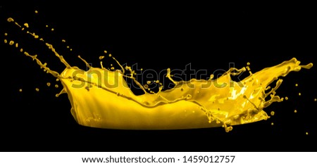 yellow paint splash isolated on black background
