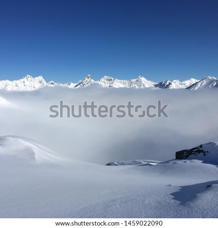 Looking Down at a sea of clouds, standing on top of the cloud inversion on top of the Austrian alps, Tirol , Austria.