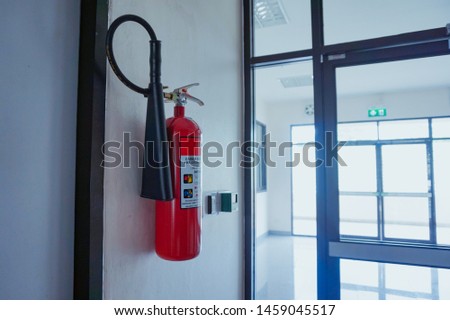 fire extinguisher hanging in the wall