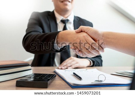 Customer and broker shake hands agreeing to buy new house at meeting after making sale purchase deal or finish buying or rental real estate with agent, Success deals concept.