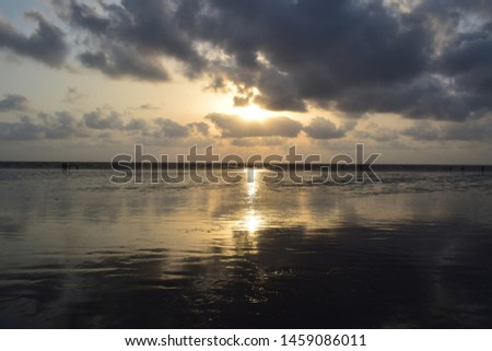 A picture of Jampore Beach in Daman, India during sunset.