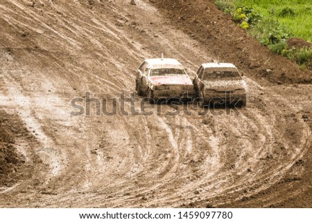 Traditional rally .The racing car drives into a steep turn, scattering, spraying dirt, dust. Extreme rally