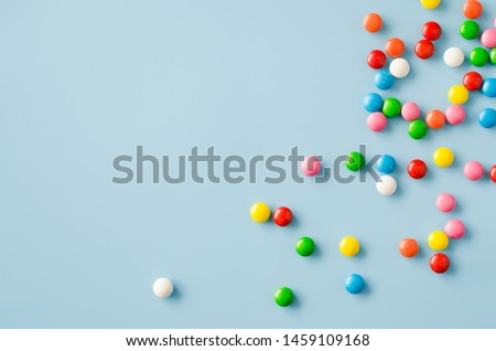 Background of chocolate candy with colored glaze. Scattered multicolored candy. Toned image Royalty-Free Stock Photo #1459109168
