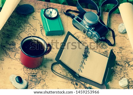 Map, tea cup, expedition equipment and diary, concept, retro style