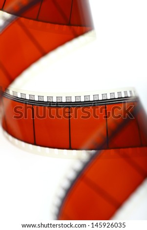 Detail of a red movie film isolated on white