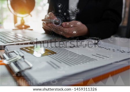 Financial report data of business operations concept. Business using smart phone with laptop and credit cards, digital tablet, Businessman hand working VR screen.