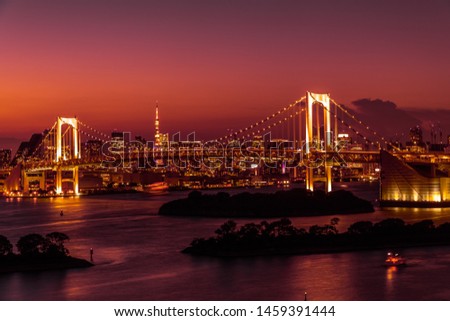 Beautiful architecture building cityscape of tokyo city with rainbow bridge at twilight sunset time in japan
