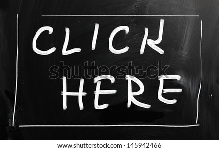 "Click here" handwritten with white chalk on a blackboard