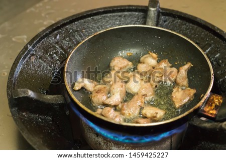 Fried pork in a pan