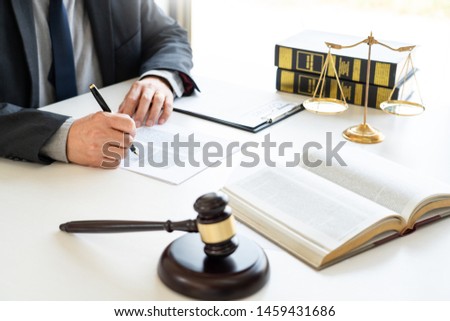 The private office workplace for consultant an young lawyer legislation with gavel and document on wood table, legal justice and judgment concept