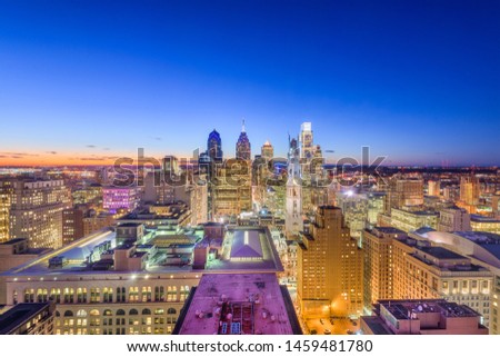 Philadelphia, Pennsylvania, USA downtown city skyline rooftop view at dusk.