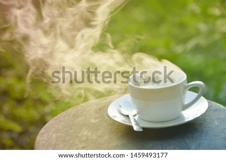 Pastel of coffee, white cup on natural green background