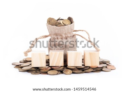 empty wooden blocks on Money bags and coins on white background.Time to invest, time value for money, money saving, finance saving and