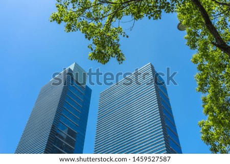 modern office building with green leaves

