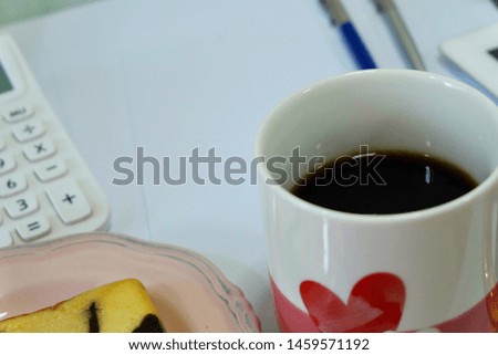 Black coffee on working business table with objects background 