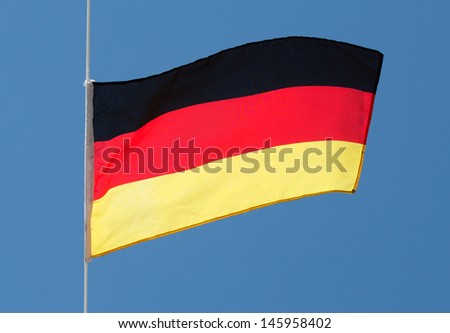  German flag in the wind against a sky