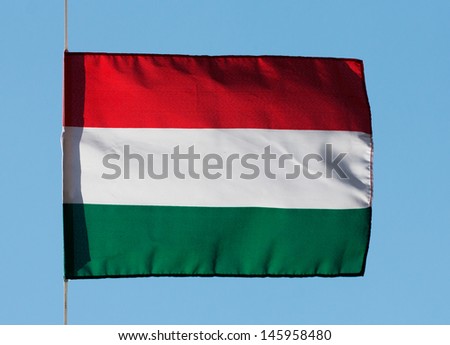 Hungarian flag in the wind against the sky