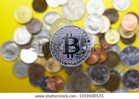 Image of Bitcoin. 
 There are  coins under the Bitcoin.