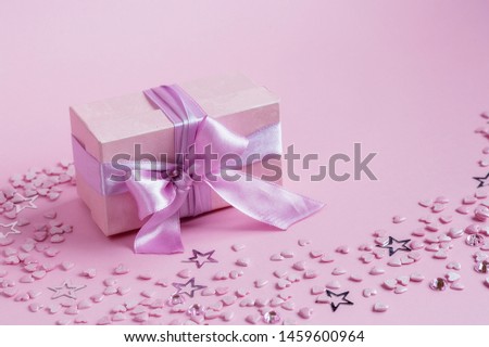 Gift box on pink background. February 14 card, Valentine's day. 8 March, International Happy Women's Day. Flat lay, top view, copy space. Moscow, april 2019