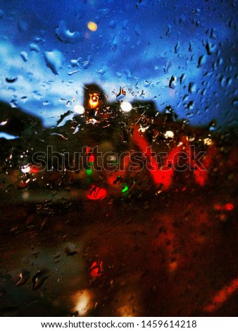 Water drop of rain on car glass