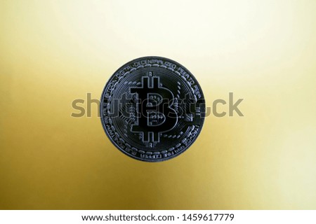 Image of Bitcoin.
Bitcoin floats on a golden background.