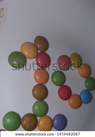 Photograph of numerical numbers written with chocolate chips .. colorful numbers for education of school kids