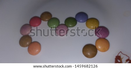 Photograph of numerical numbers written with chocolate chips .. colorful numbers for education of school kids
