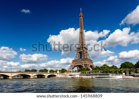 Eiffel Tower and Seine River with White Clouds in Background, Paris, France