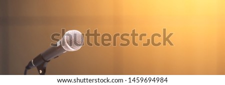 Microphone on abstract blurred of speech in seminar room or speaking conference hall light Royalty-Free Stock Photo #1459694984