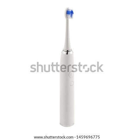 White electronic ultrasonic toothbrush isolated on a white background