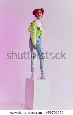 woman  stands on a cube fashion retro style