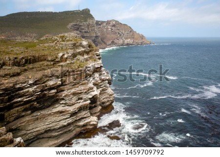 Rocky coast at the Cape of Good Hope with steep cliffs of rock strata
