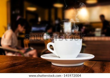 cup of coffee on table in cafe  Royalty-Free Stock Photo #145972004