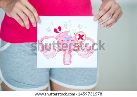 asian woman with cartoon womb billboard and feel bad