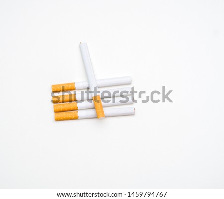 Stop smoking messaging, cigarettes on white background lined up