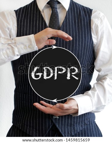 Man holding a sign with the acronym GDPR (General Data Protection Regulation) written on it