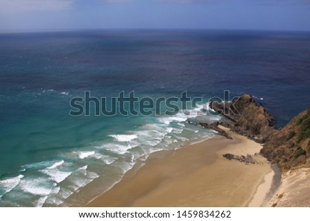 Dream beach with sand and turquoise colored water
