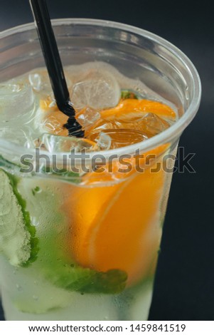 Refreshing drinks for summer, cold sweet and sour lemonade juice with ice cubes in the glasses  
