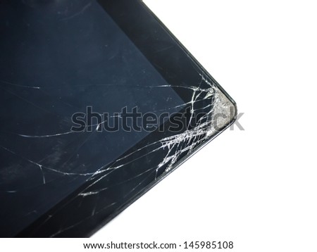 Tablet computer dropped then the glass surface cracked at the corner. Isolated on white background