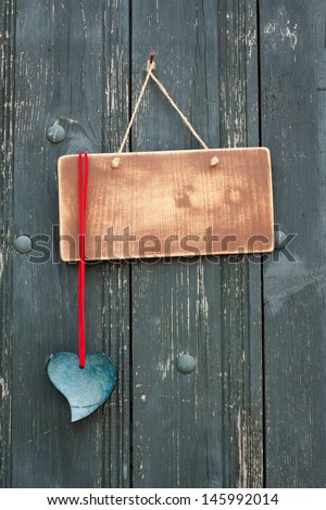 Vintage wooden signboard, handmade love heart on wood planks background