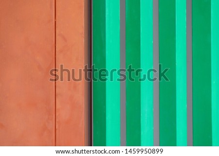 Colorful background of the orange wooden door and edge door in left and  green wooden windows in right outside the building, according to Japanese Buddhist art at Yakushiji temple,Nara,Japan