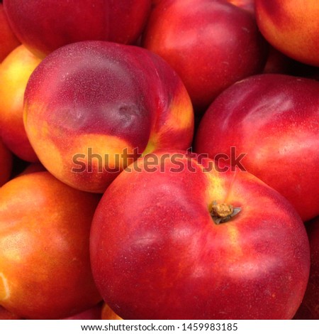 Macro Photo food tropical fruit nectarine. Texture background sweet red ripe nectarine. Image food fruit nectarine